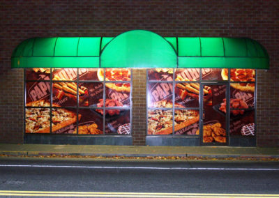 This wall of windows turns into a billboard that looks good enough to eat.